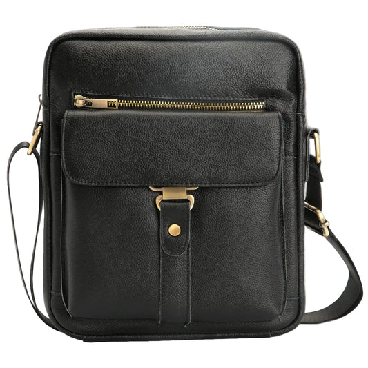 Black leather crossbody bag with gold accents on a white background