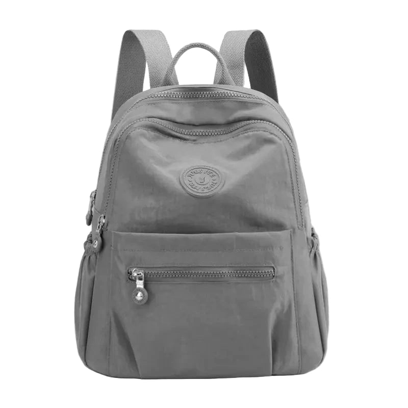 Gray backpack with a visible brand logo on a white background