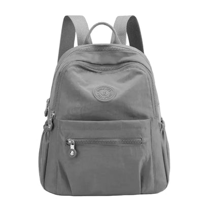 Gray backpack with a visible brand logo on a white background