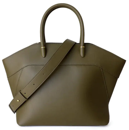 Green leather handbag with a strap on a white background