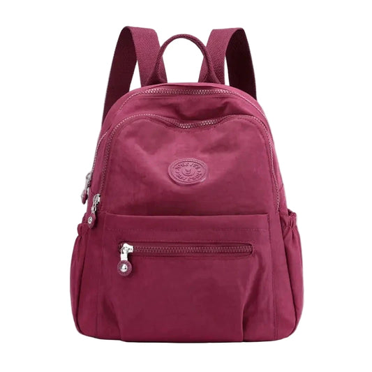 Maroon backpack with visible brand logo on a white background