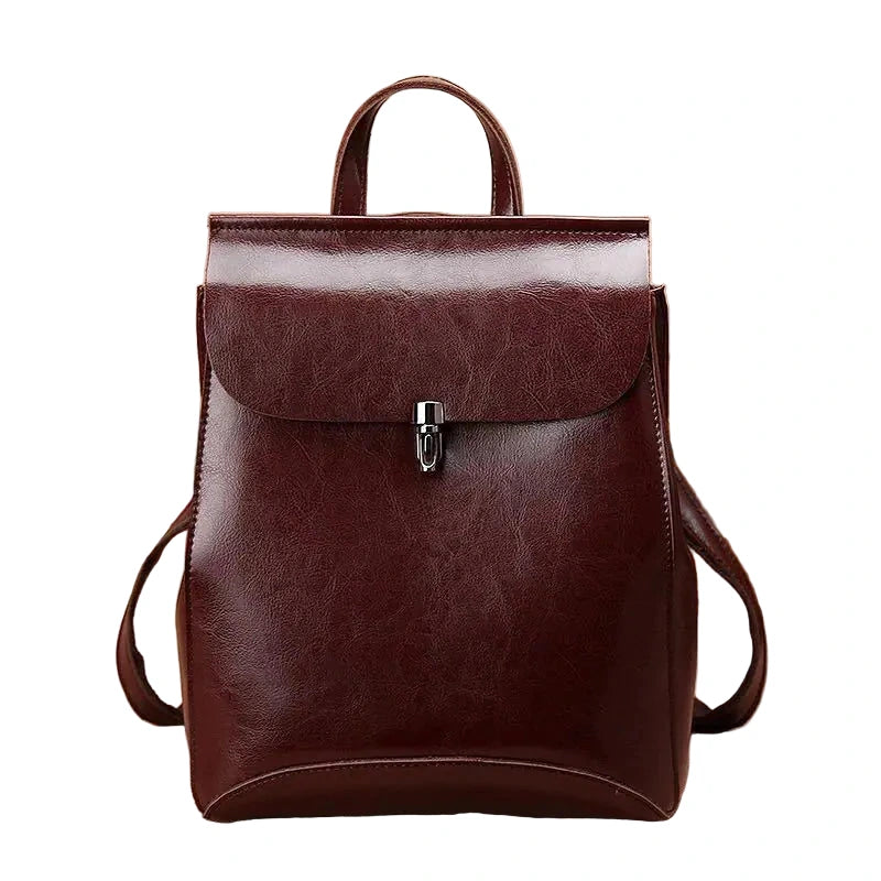 Brown leather backpack on a white background
