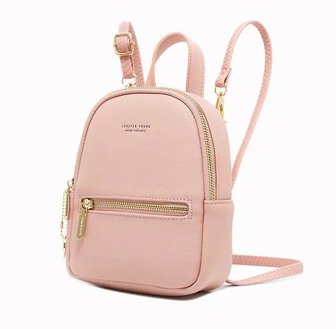Pink backpack with gold zippers on a white background