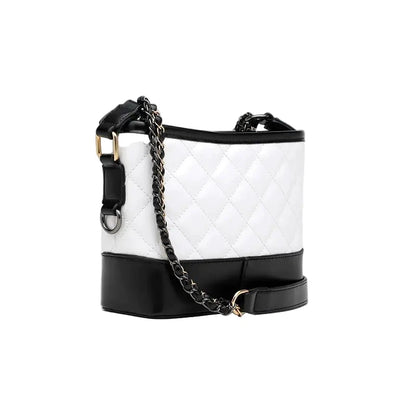 White quilted handbag with black accents and a chain strap on a white background