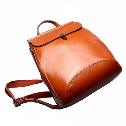 Brown leather backpack on a white background
