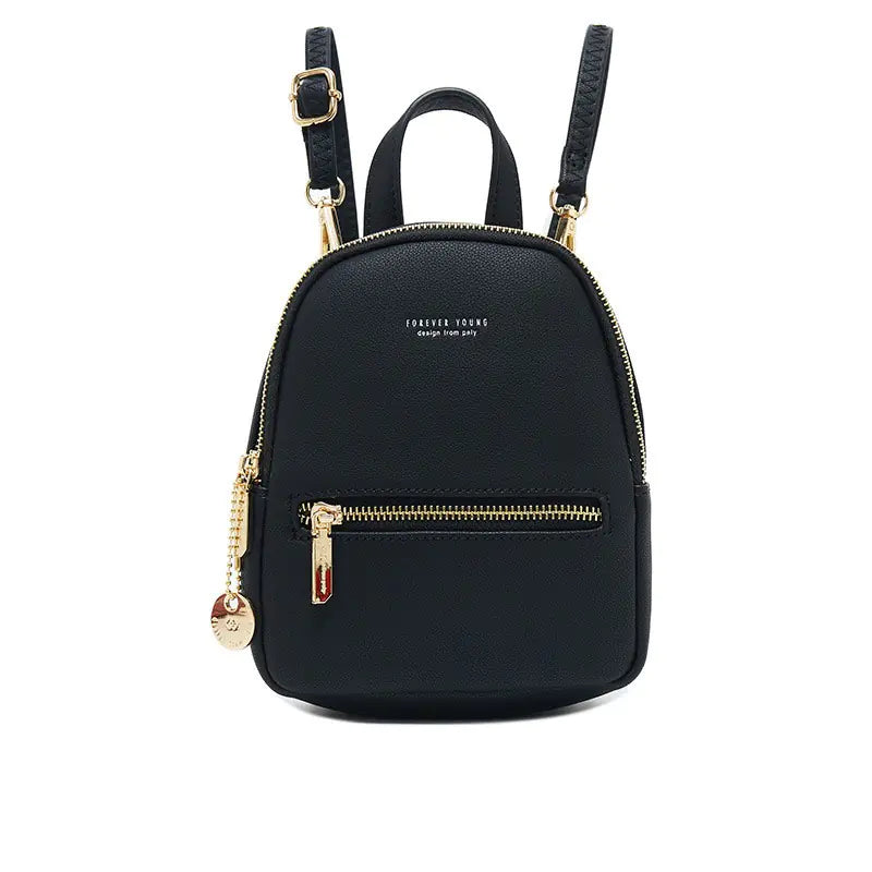 Black backpack with gold zippers and accents on a white background