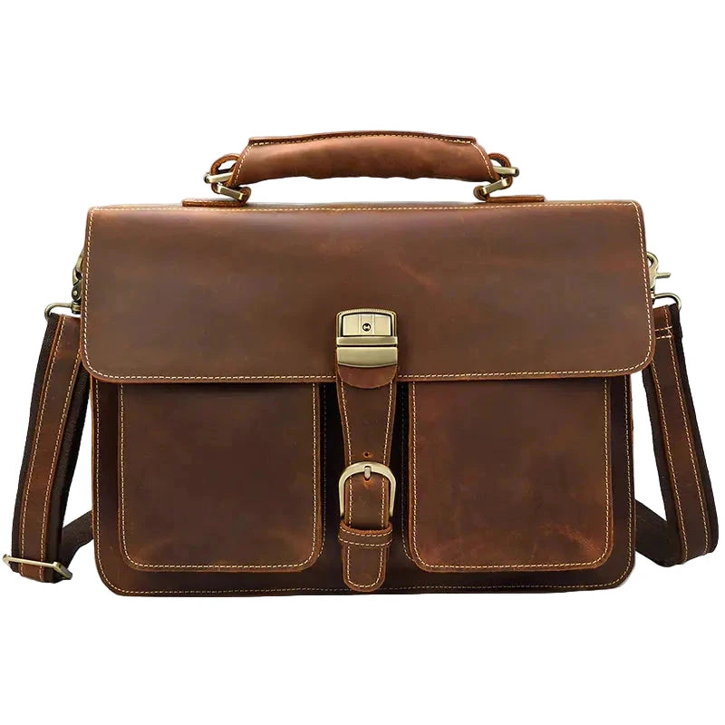 Brown leather satchel bag with gold accents on a white background