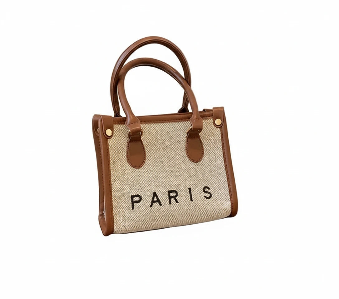 Handbag with 'PARIS' text on a white background