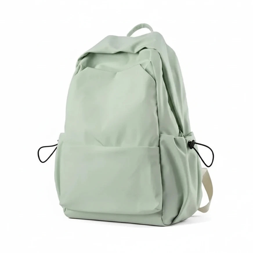Light green backpack with features listed on a white background