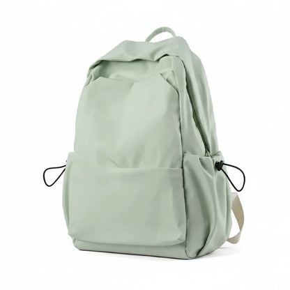 Light green backpack with features listed on a white background