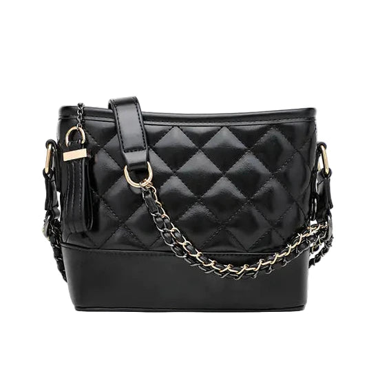 Black quilted handbag with gold chain detail on a white background