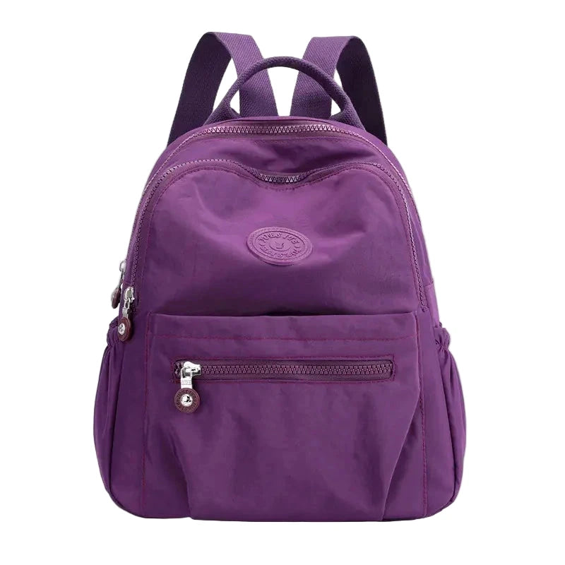 Purple backpack on a white background