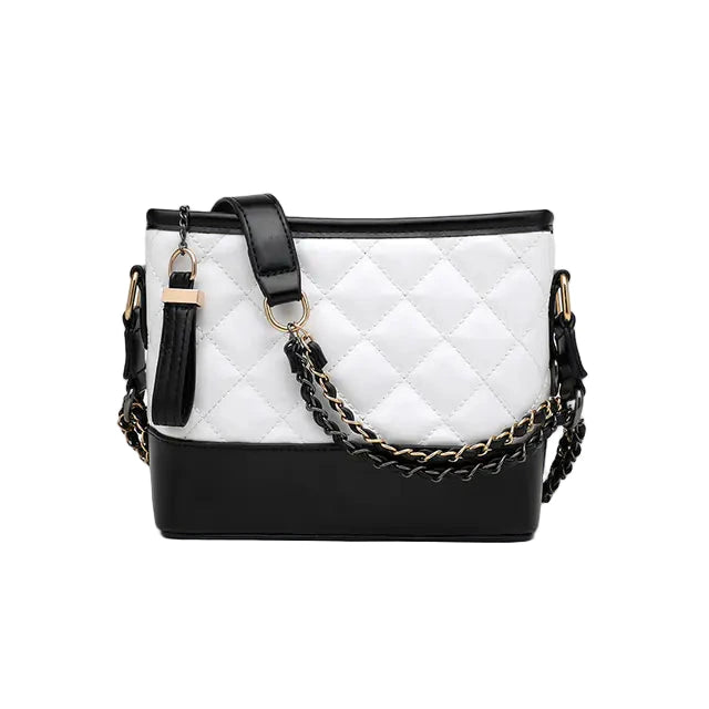White quilted handbag with black accents and a chain detail on a white background