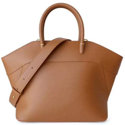 Brown leather handbag with a strap on a white background