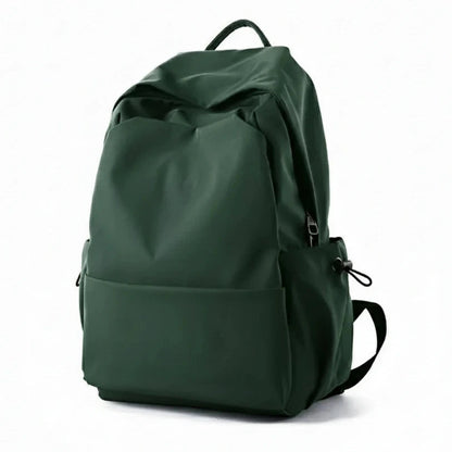 Green backpack with features listed on a white background