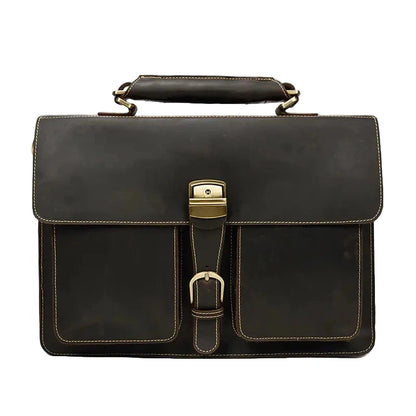 Black leather briefcase with gold hardware on a white background