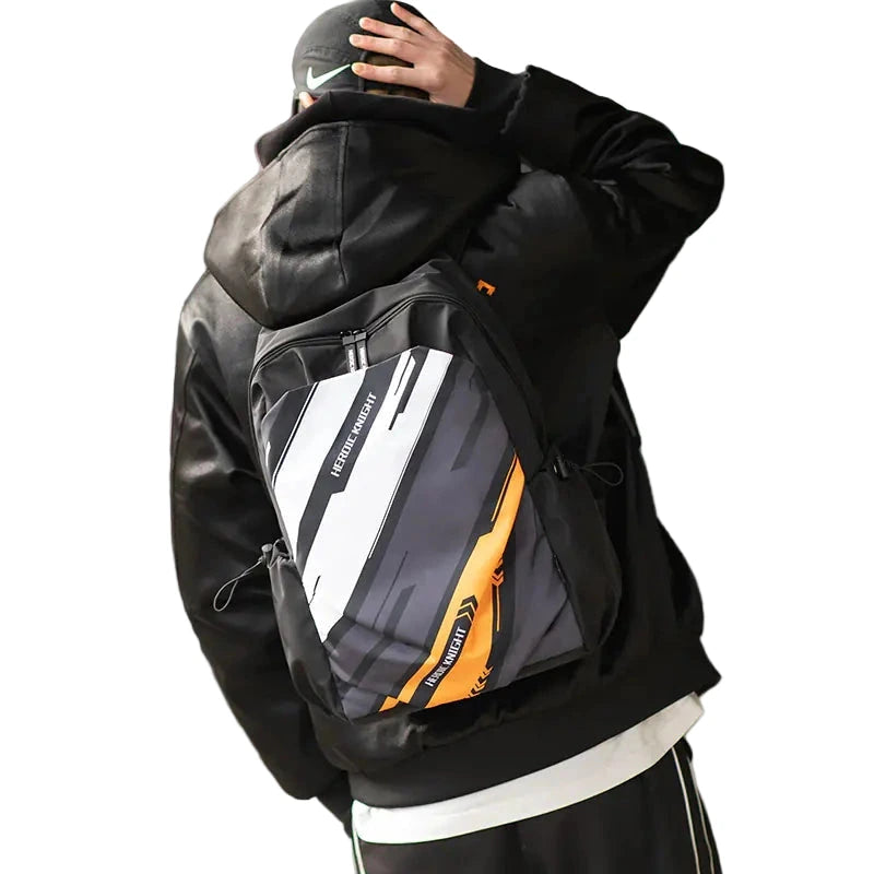 Person wearing a black jacket with a gray and orange backpack